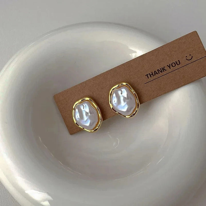 Élégantes boucles d'oreilles en perles de Carmen