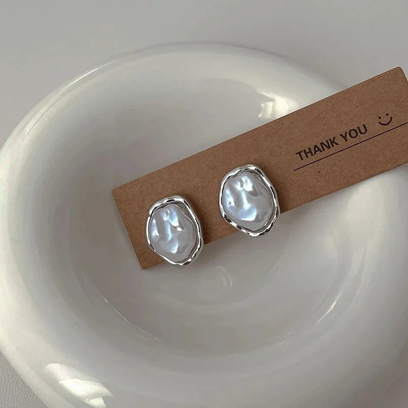 Élégantes boucles d'oreilles en perles de Carmen