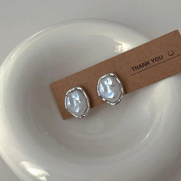 Élégantes boucles d'oreilles en perles de Carmen