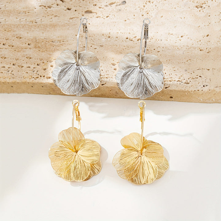 Boucles d'oreilles en or exagérées et creuses