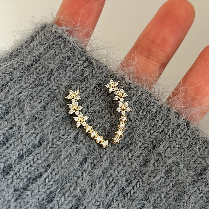 Boucles intemporelles d'oreilles florales