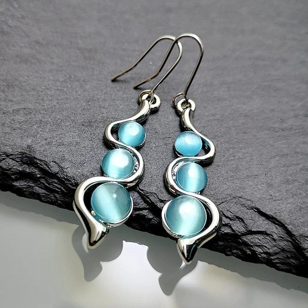 Boucles d'oreilles en cristal bleu pendantes