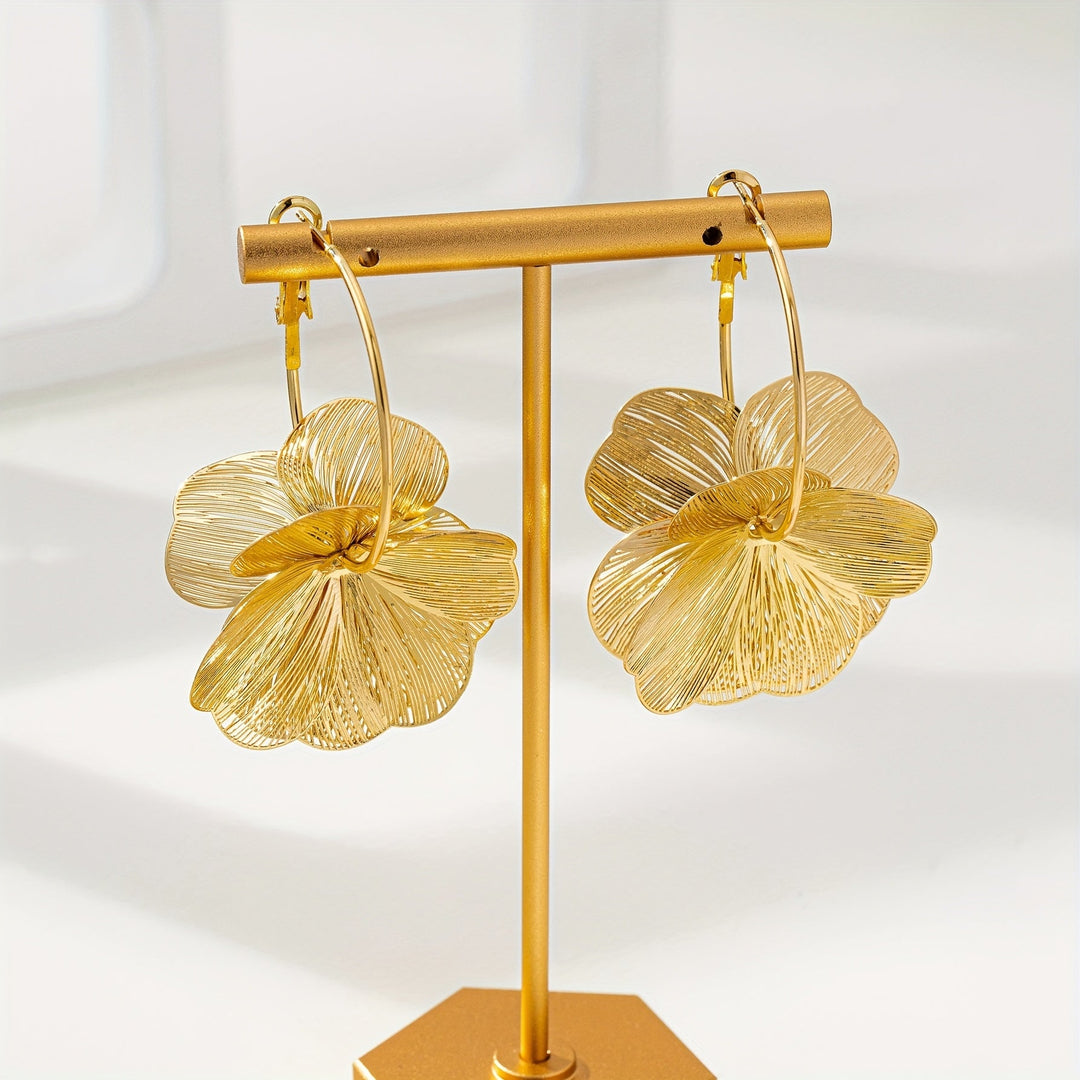 Boucles d'oreilles en or exagérées et creuses