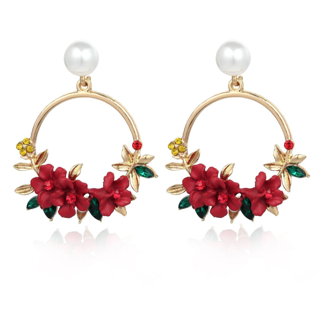 Boucles d'oreilles en or élégantes ornées de fleurs et de perles