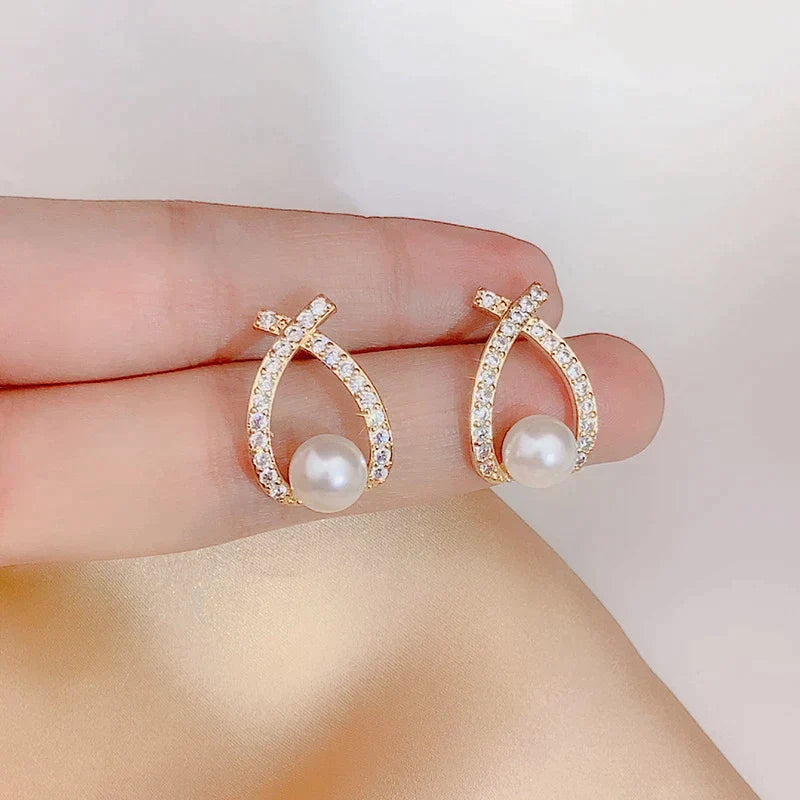 Boucles d'oreilles ornées de perles et de paillettes
