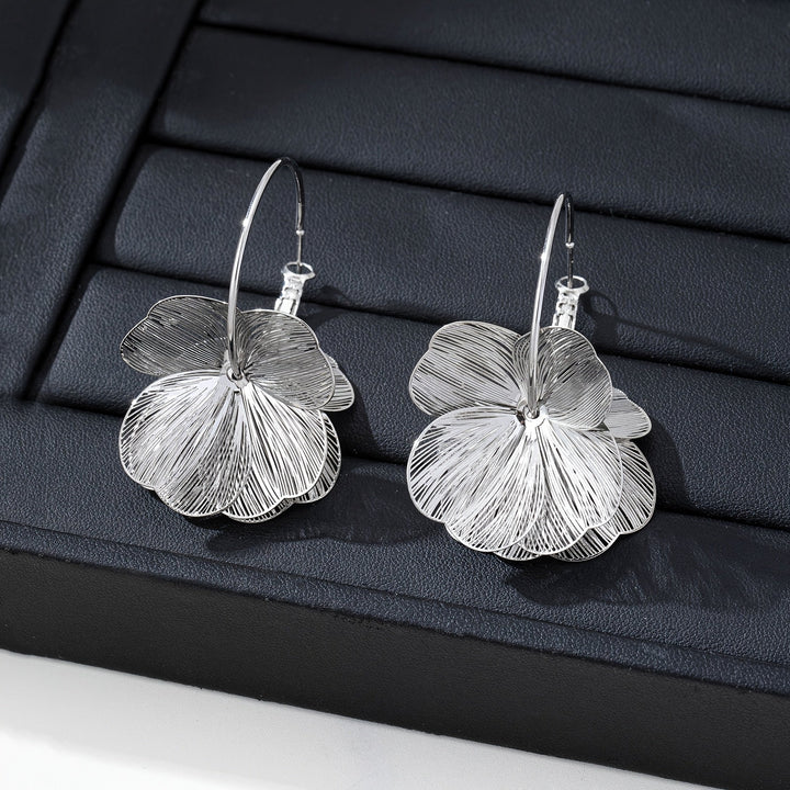 Boucles d'oreilles en or exagérées et creuses